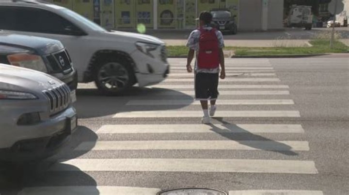 Do I really have to wait until a pedestrian is completely through the crosswalk?