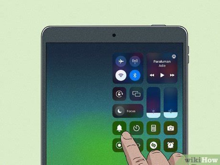 How do I control YouTube volume on iPad?