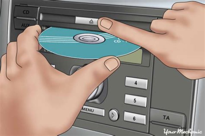 How do I remove a stuck CD from my Macbook?