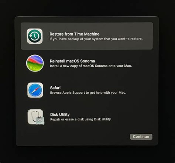 How do I restore photos from Time Machine to a new Mac?