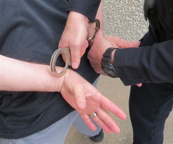 How do police put handcuffs on?