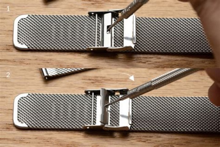 How do you adjust a stainless steel watch band?