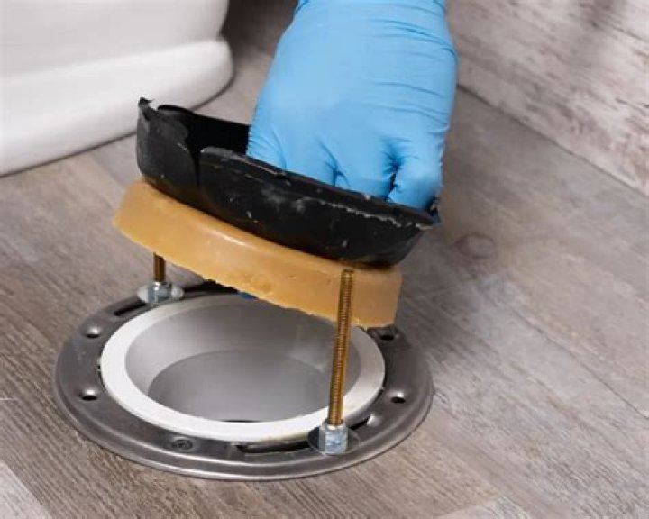 How do you clean toilet wax seal?