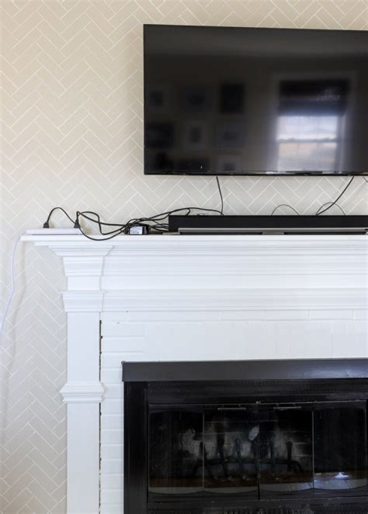 How do you hide the cords on a fireplace?