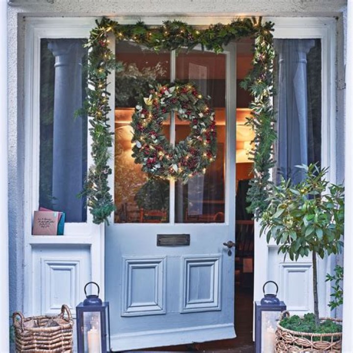 How do you secure a garland over a front door?