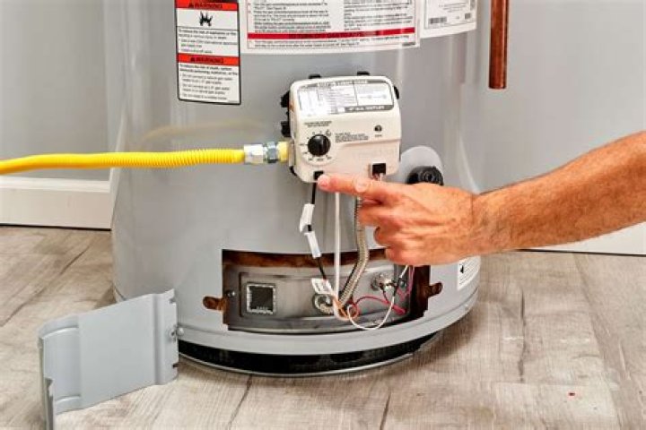 How should a gas hot water heater be vented?