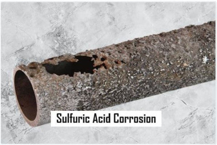 Is acetic acid corrosive to metal?
