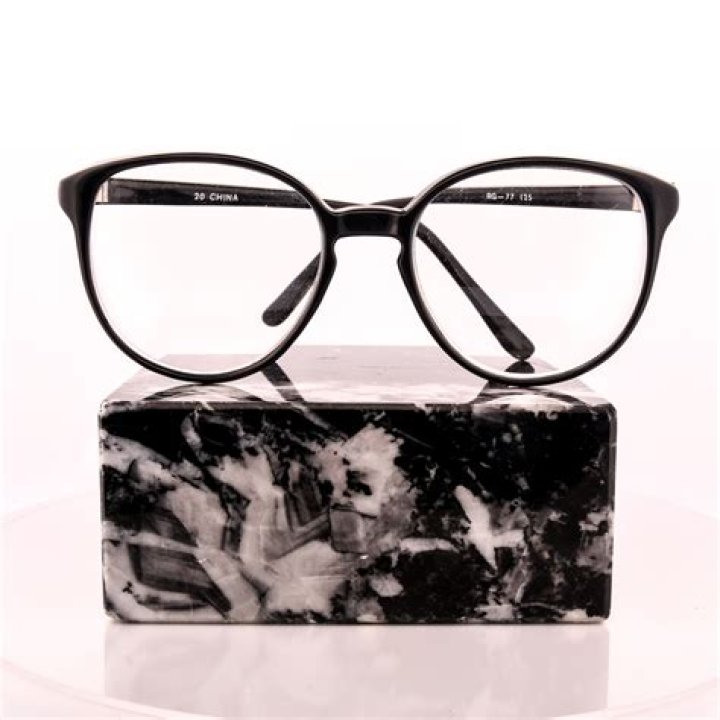What brand glasses does Diane Keaton wear?