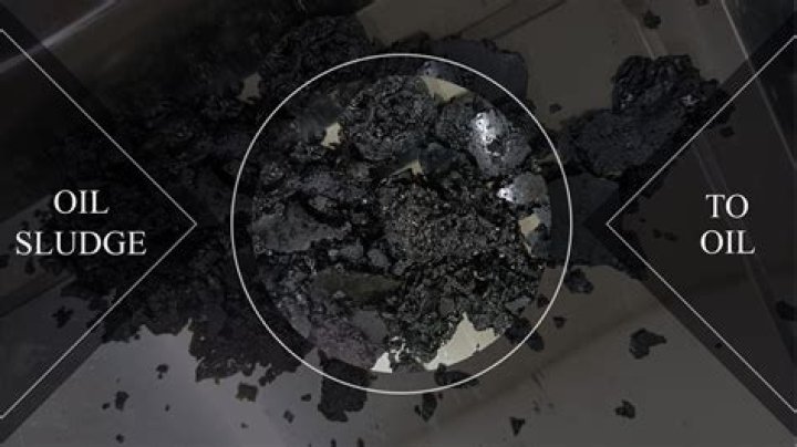 What chemical breaks down oil sludge?