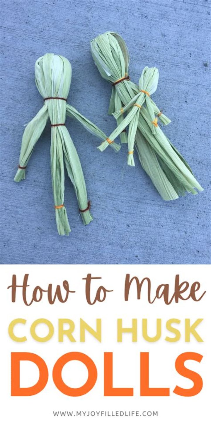 What do corn husk dolls represent?