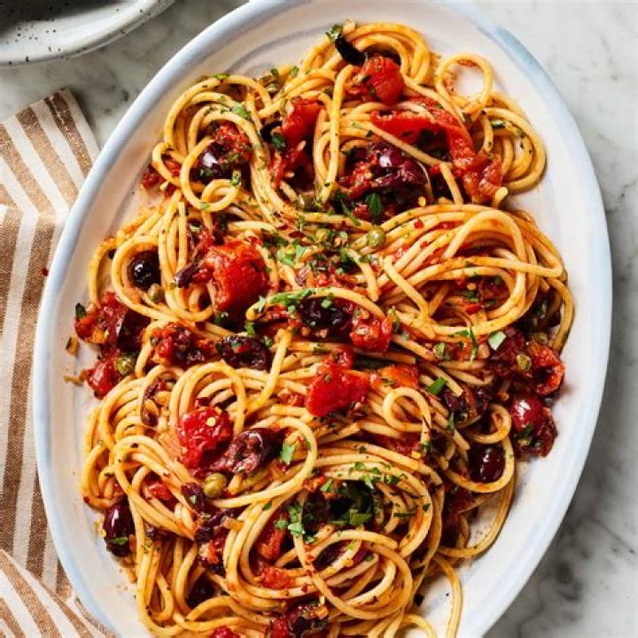 What does pasta puttanesca mean in Italian?
