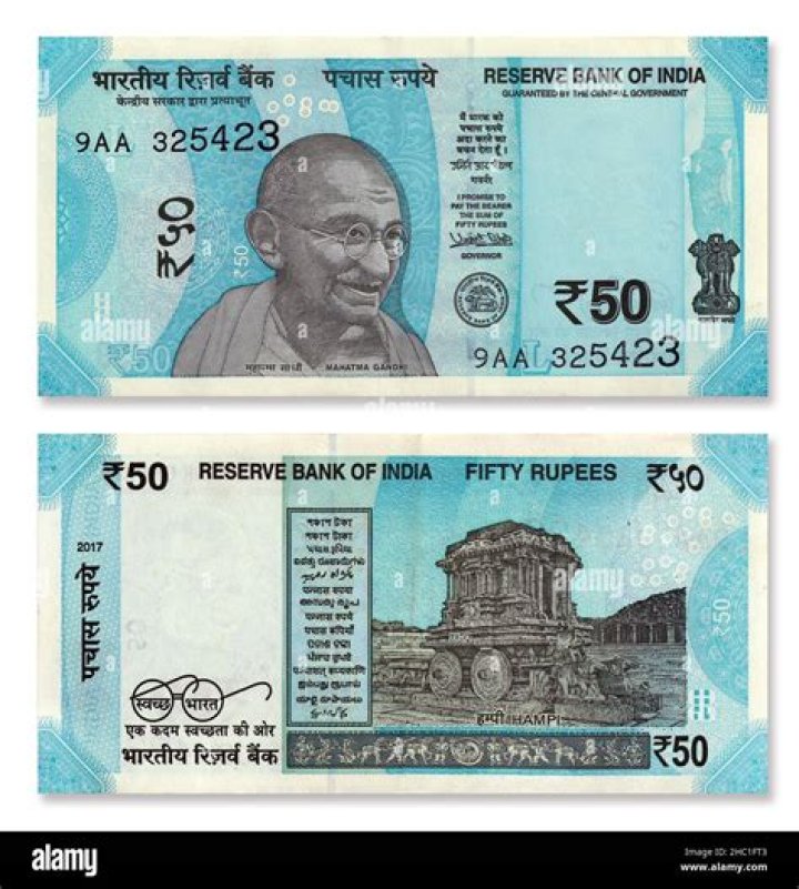 What is the picture behind 5 rupee note?