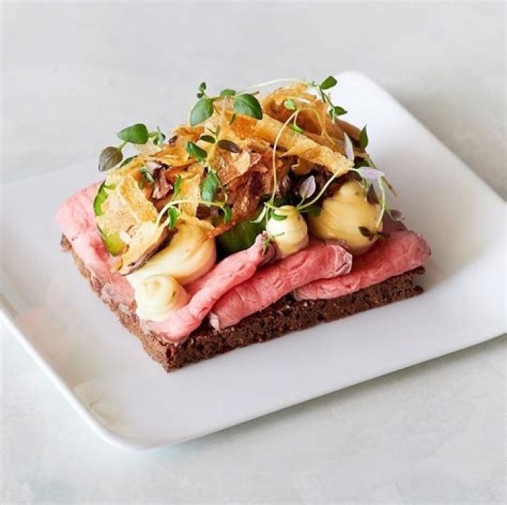 What might be on an open faced Danish Smorrebrod sandwich?