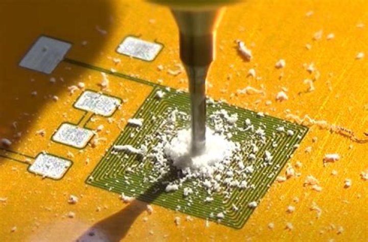 What tool is used to drill holes in the printed circuit board?