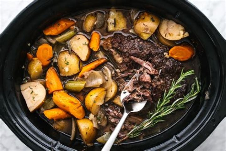 When should I add vegetables to crock pot roast?
