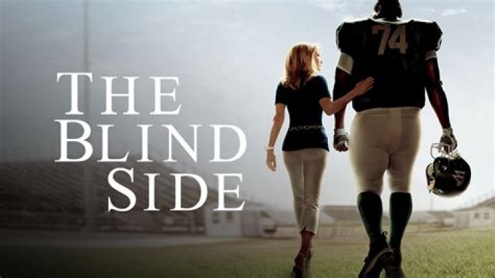 Why does Leigh Anne help Michael in the blind side?